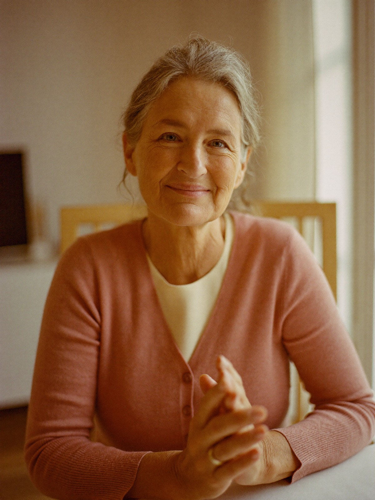 Isabell, founder of Isabell's Home Care — a warm portrait by a bright window